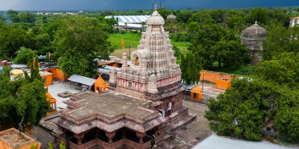 Aerial view of Grishneshwar Jyotirlinga Temple surrounded by greenery near Ellora, Aurangabad